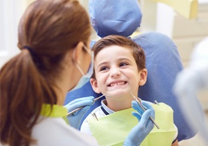Smiling little boy in the dental chair 