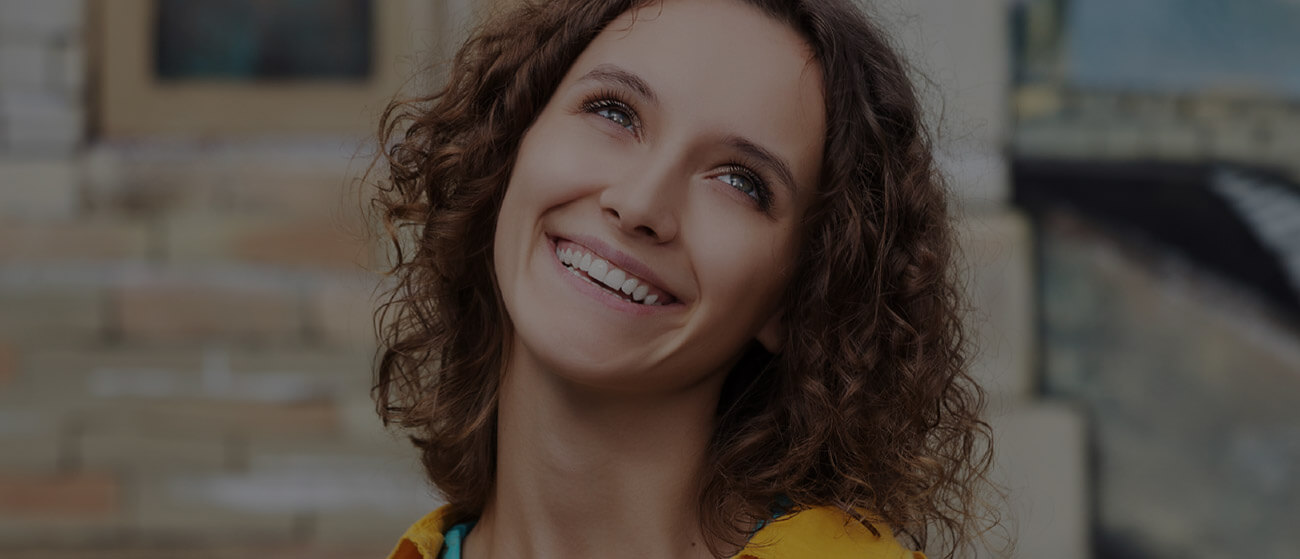 woman looking up, smiling