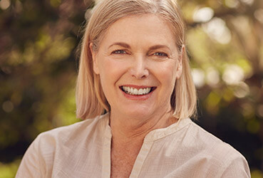 woman with blonde hair, smiling