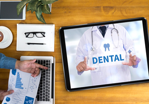 Dentist explaining dental insurance benefits 