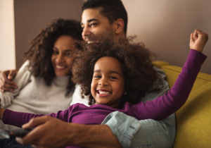 husband & wife playing with their daughter