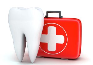 Model of a tooth next to a first-aid kit