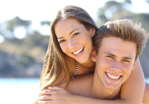 A young girl and guy smiling