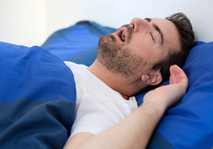 A man sleeping with his mouth open