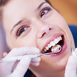 woman smiling during dental checkup