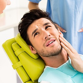 man suffering from toothache having a dental exam