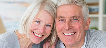 husband & wife wearing gray shirts