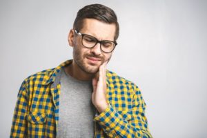 Man suffering from dental pain. 