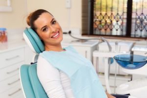 A woman in the dental chair with a beautiful smile. 